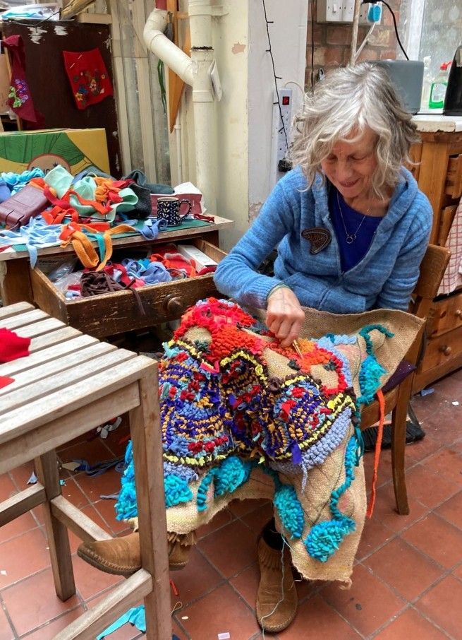 Lu Mason making a rag rug in her studio