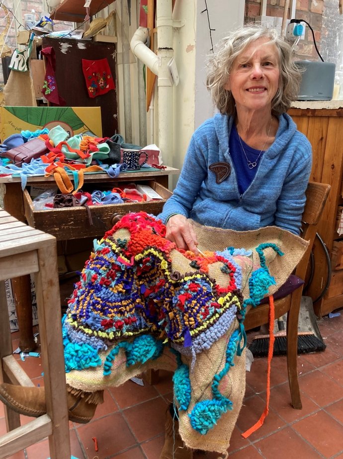 Lu Mason making a rag rug in her studio