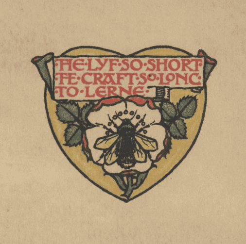 An emblem in the shape of a yellow heart with a rose and a manchester bee in the centre.