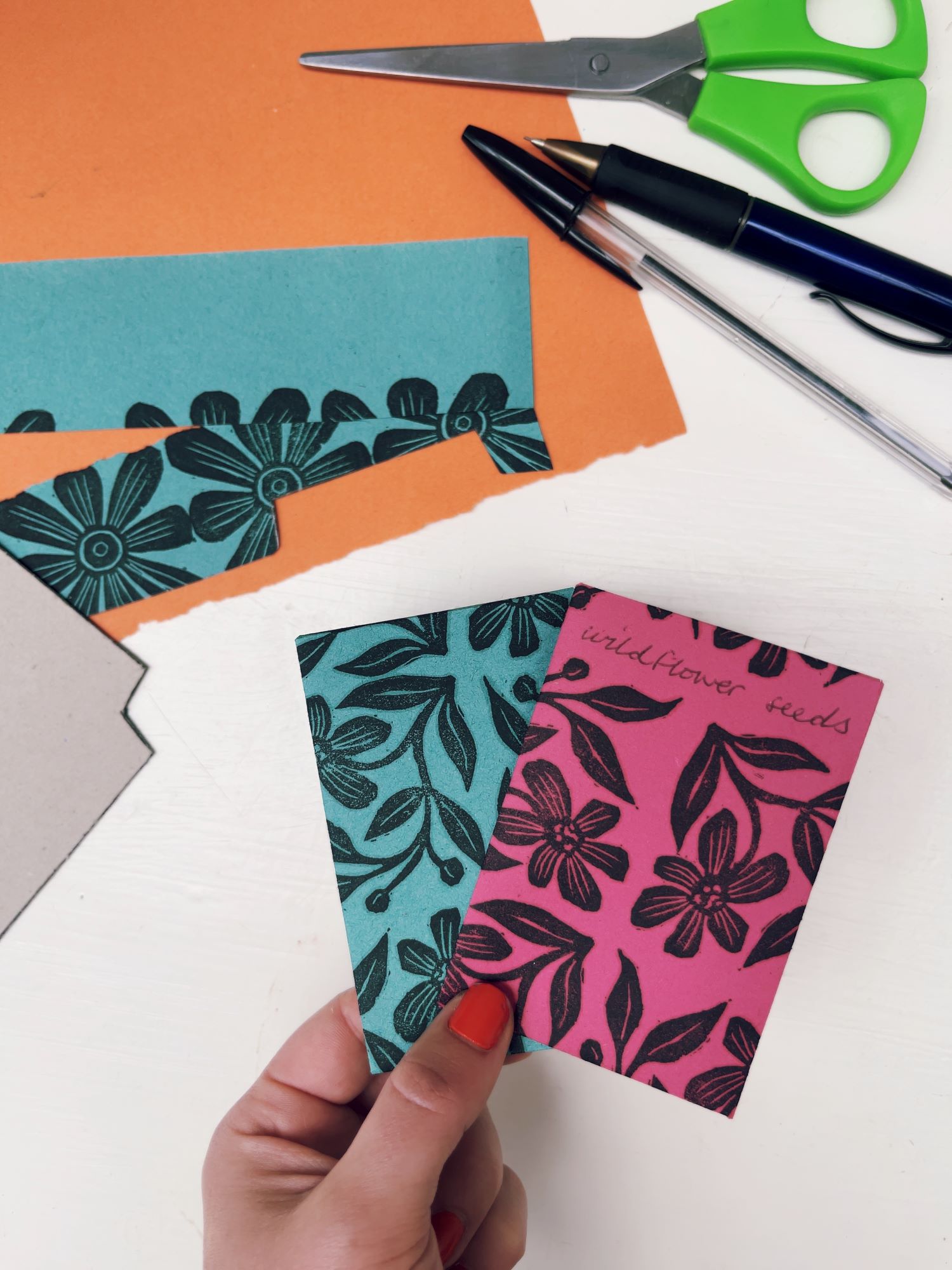 Nastasha Boyce Seed Packets block lino prints with examples in pink and blue